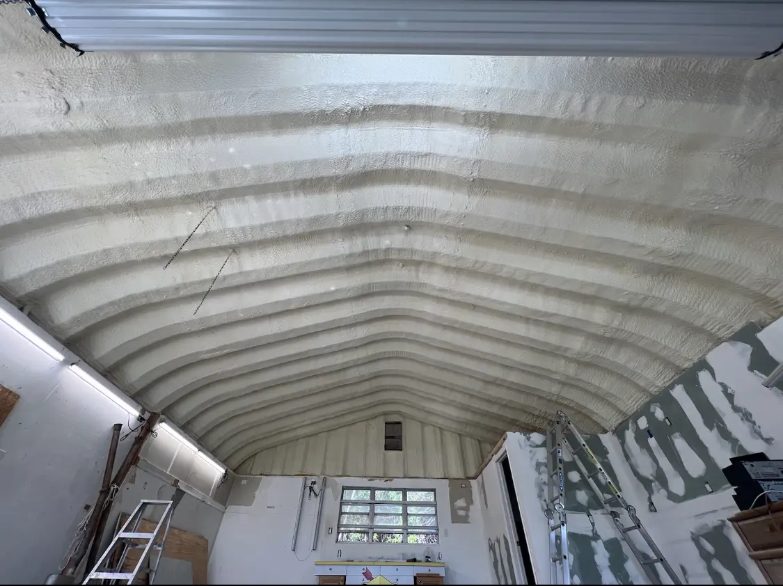 Spray polyurethane foam applied to the underside of a metal roof deck in Macon-Bibb County